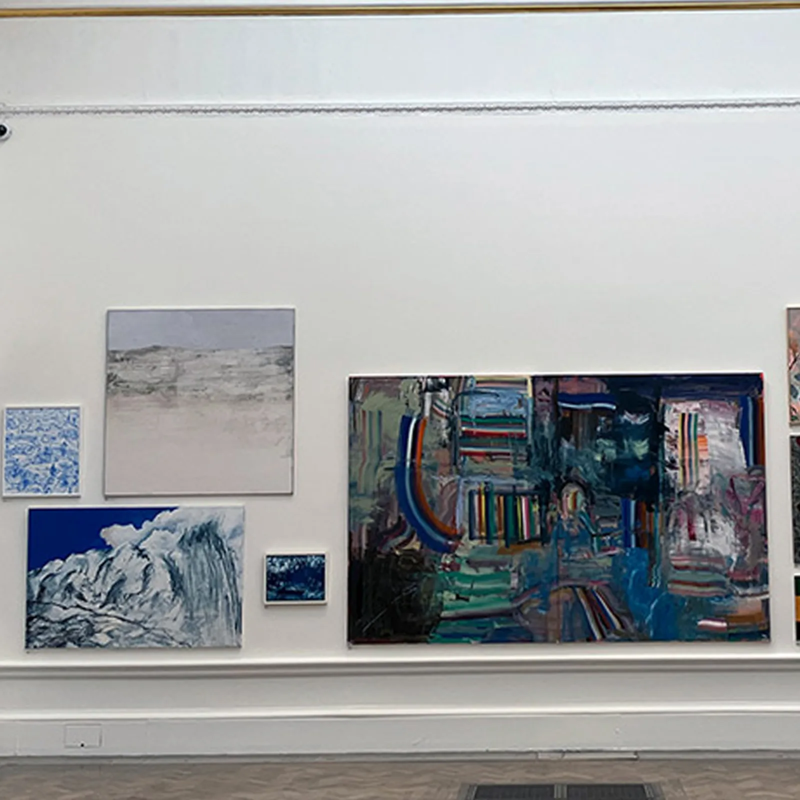 Adrian Dică's landscape paintings hung among works by other selected artists at the Royal Academy Summer Exhibition 2024, showing how a submitted work reads within the final curatorial context